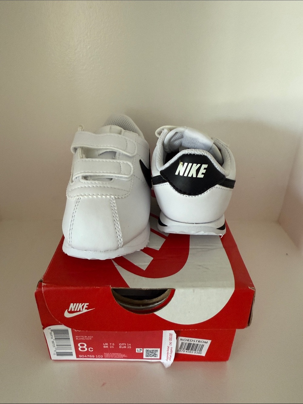 Nike Kids White Sneakers with Black Heel Accent